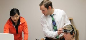 Sandy Wright (middle) works on baseline testing with School of Health and Exercise Sciences students Tanis Burnett (left) and Jessie Carmichael (right).