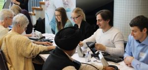 Nursing students Tajaira Thiessen and Danielle Labuik work alongside medical students Rob Trasolini and Jordan Nostedt to measure blood pressure for participants at the recent Diversity Health Fair.