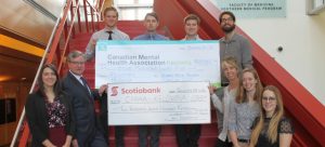 (L-R): Stephanie Maguire, MNP, Wayne McNiven, Scotiabank, SMP students Alex Rudecki, Buzz Mason, Landon MacGillvray, Thomas McFarland, Shari Slattery, CMHA Kelowna, and SMP students Patty Massel and Rosie Mazzola.